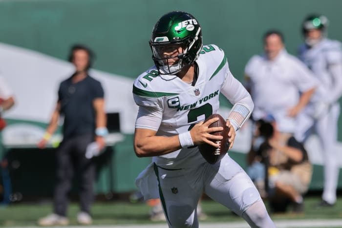 New York Jets quarterback Zach Wilson (2) rolls out during the second half against the New England Patriots at MetLife Stadium.
